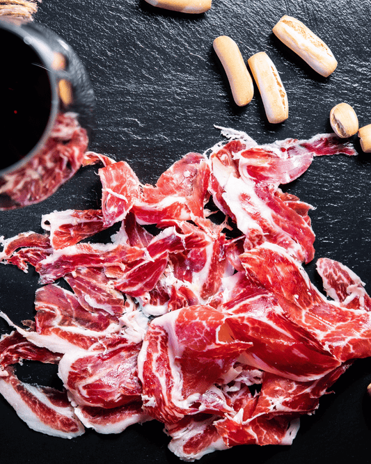 Jamón Ibérico Spanish cured ham thinly sliced and ready to serve