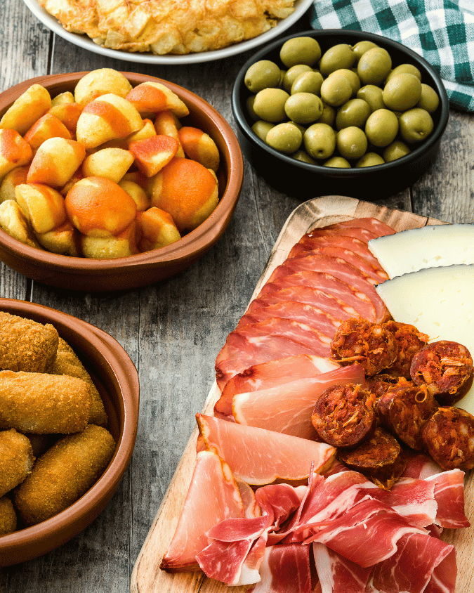 Thanksgiving appetizers with Spanish tapas, olives, cheese and almonds