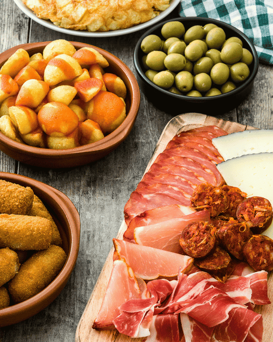 Thanksgiving appetizers with Spanish tapas, olives, cheese and almonds