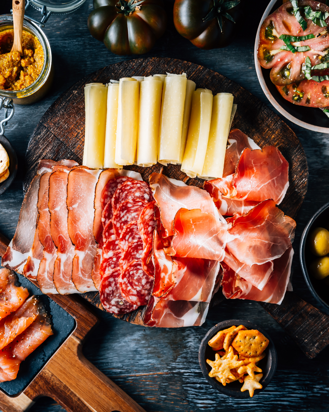 Spanish Iberico ham, chorizo and salchichón arranged on a charcuterie board for tapas and gourmet dining