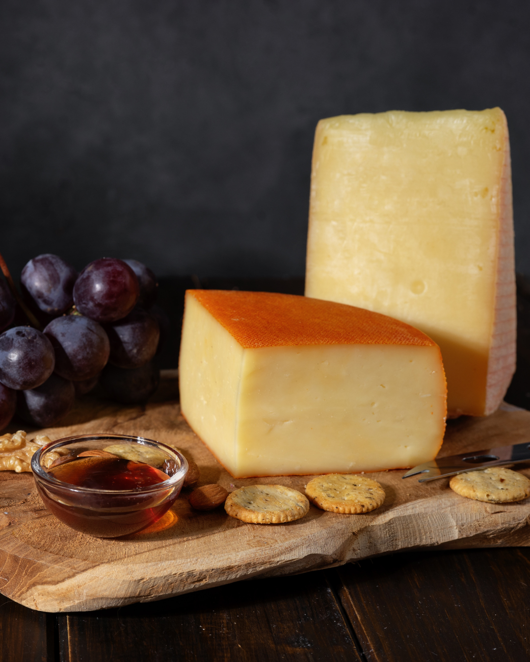 Selection of Spanish cheeses including Manchego and artisan varieties served on a board for tapas and gourmet pairings